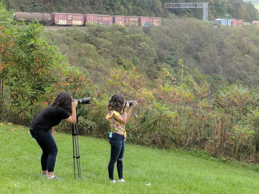 Waiting patiently
Seniors Samatha Rolls and Kierra Moist capture photos as a train travels around the Horseshoe Curve.  Students rode the incline to the top and had a long wait for the train. 
