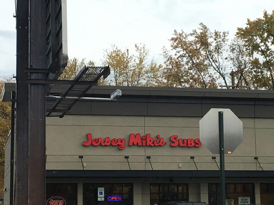 The outside of Jersey Mike’s provides a lot of parking for people to come in and get a sub. The outside features a bright and colorful sign that will appeal the attention from drivers who pass by. The outside is includes entertaining music, cool and different wall art.