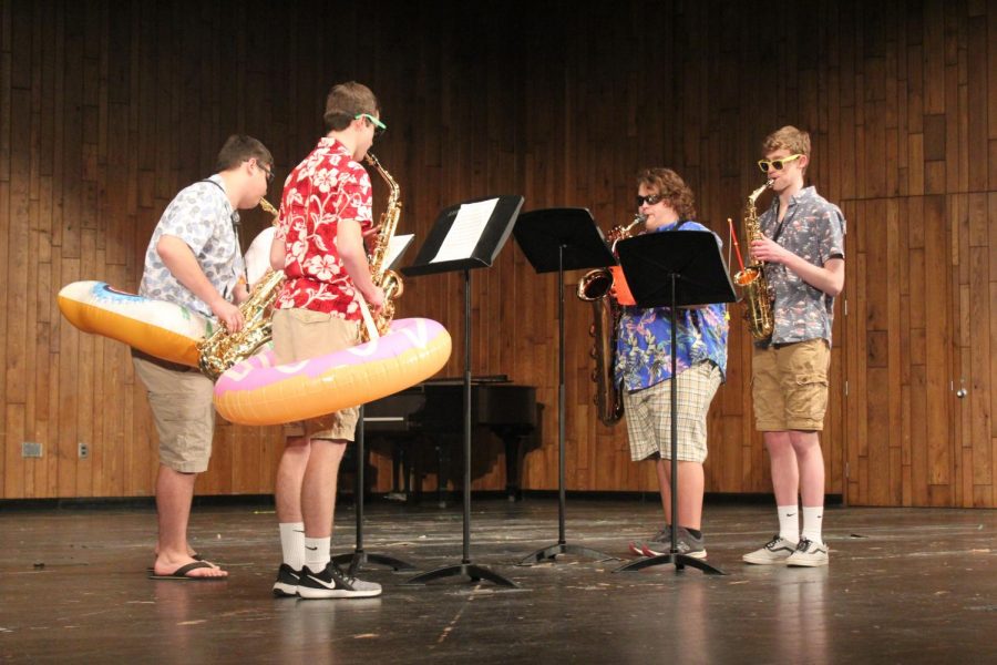 Michael Baker, Levi Long, Aiden Phillips and Ian Brannan perform Yakety Sax. We decided to wear Hawaiian shirts because we were playing a fun song and thought that it would add to the performance, Phillips said.  