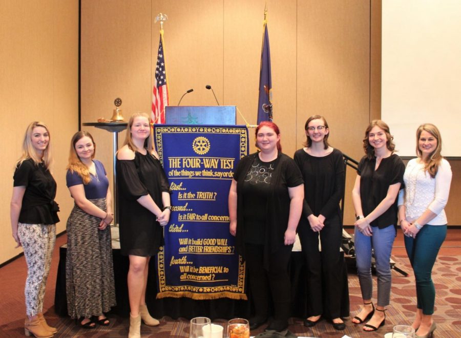 Heather Tippett-Wertz along with the five competitors and student teacher, Carly Schankowitz stand for a picture at the end of the contest.  Also pictured is the list of 4-Way tests that gave directions and set a foundations for addressing the topics presented.