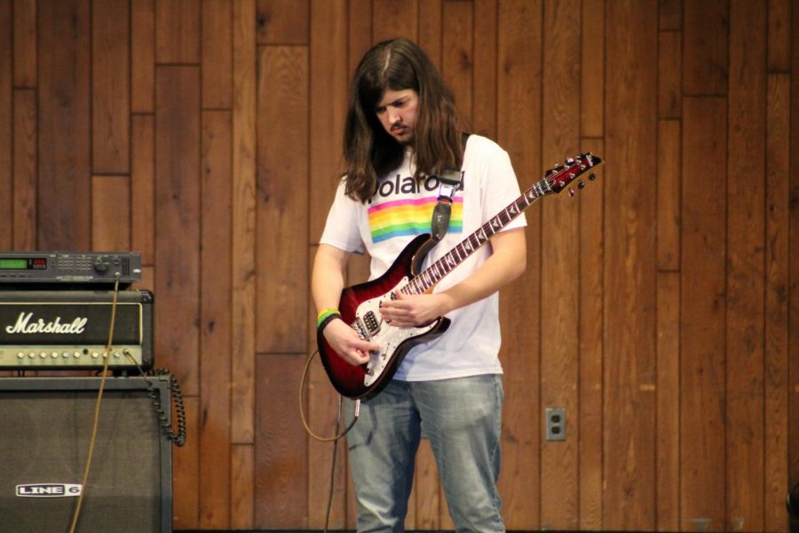 Sophomore Jason Cross plays Eruption on the electric guitar.
