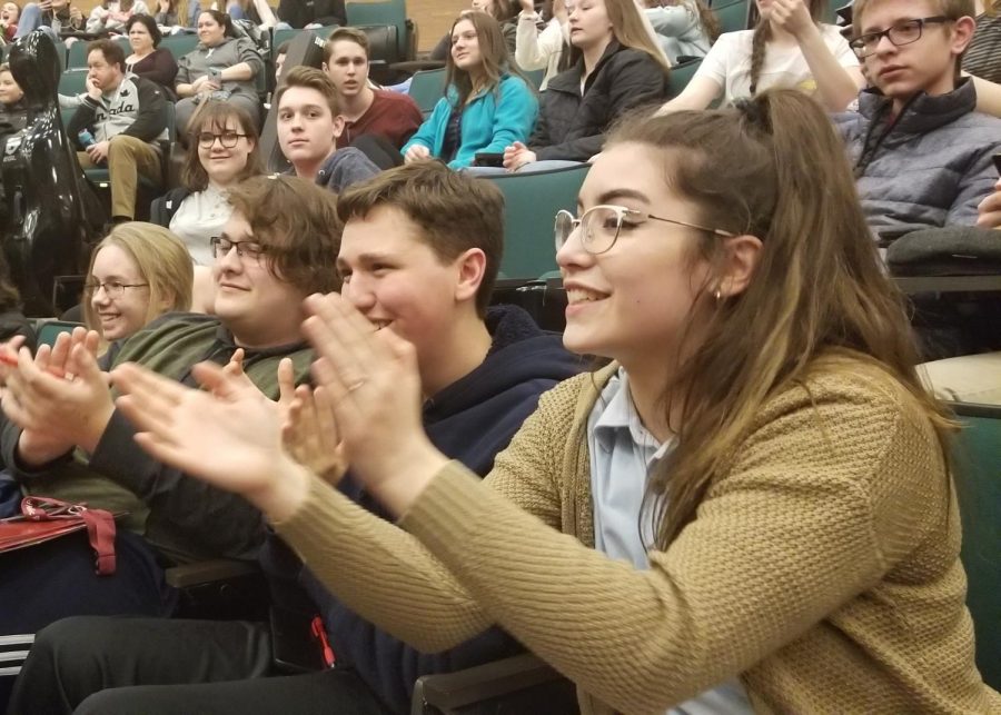 Senior Nathalia Daversa, sophomore Alex Thaler, sophomore Aiden Phillips and sophomore Joshua Terza clap during the awards ceremony. Around 35 students from Altoona placed. 