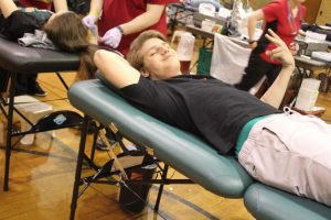 Smiling Through The Pain! Senior Devon York smiles for a photo while giving blood. York has previously donated blood before.