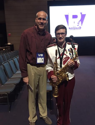 A round of applause for the musicians.
Senior Ian Brannan and band director Larry Detwiler pose for a picture in celebration of the festival. From April 3 to April 6, selected musicians participated in the PMEA all-state music festival in Pittsburgh.