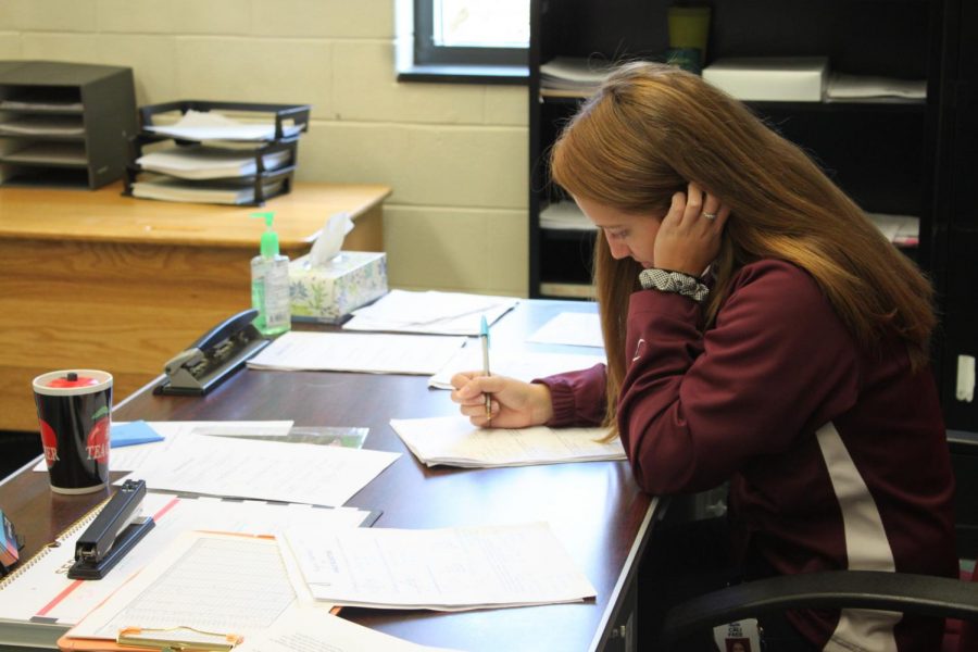 Cali Free grades papers and settles into her new teaching job.  This is her first teaching job here at Altoona High, and the Mountain Lions have welcomed her with open arms. 