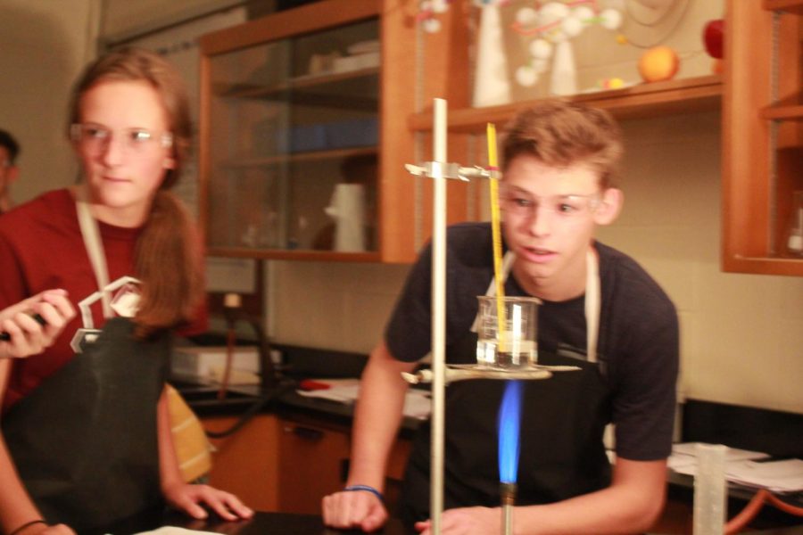 Watch+this%21+Sophomores+Ashtyn+Hileman+and+Brock+Vancas+work+on+their+Bunsen+burner+lab+in+their+seventh+period+chemistry+class.+