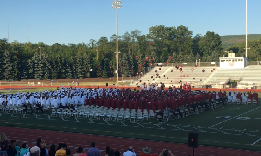 The graduating class of 2018 throws their caps into the air at the end of the ceremony. The Central PA Graduation Initiative is an aid for students who do not feel confident in graduating. 