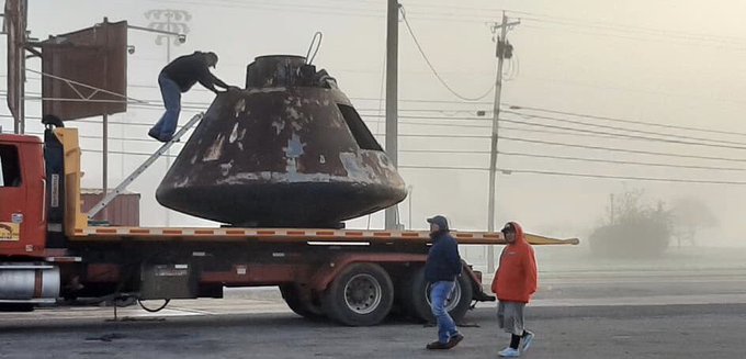 The Apollo space capsule is loaded on the back of a flatbed truck for transport. Altoona High Schools planetarium and space race museum has been recognized by NASA as an official museum. 