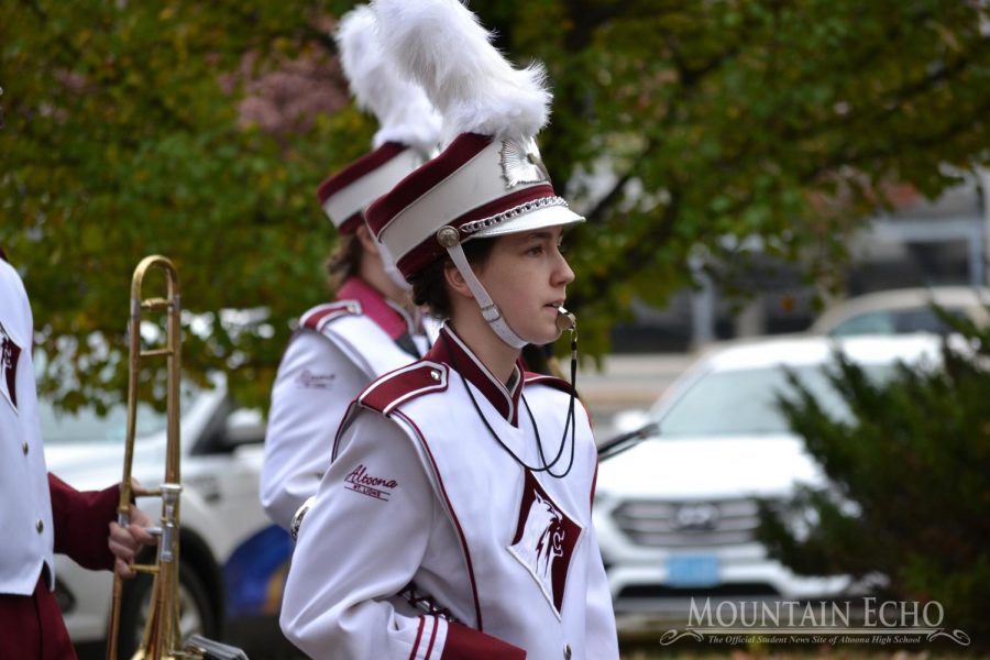 Drum major Maeve Wonderly leads the band down the street during the parade. Wonderly was also drum major when she was a freshman. 
