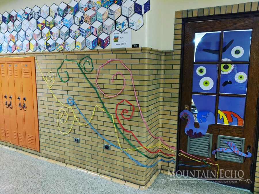 Arts and Crafts! Art teacher Kathryn Curry and her Art in public places class wins the door decorating contest sponsored by the Maniacs group at the high school. The class won a pizza party reward for their victory on showing their art abilities through the creation of the theme. 