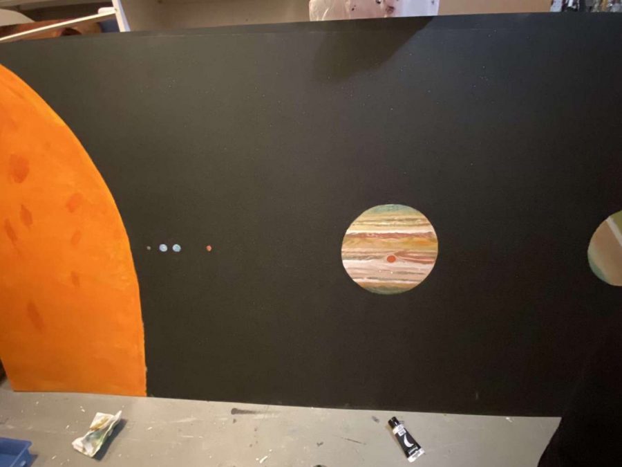 Stars and Galaxy Senior Allison Peterman creates a mural of the solar system for her senior project. Peterman chose this as her senior project because she wanted to give back to Astronomy teacher James Krug a gift for the planetarium. 