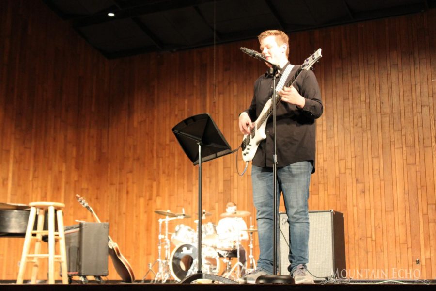 Rock and roll!
Senior Trey Harkins rocks out on the guitar while playing N.I.B. with junior Aaron Saylor on the drums. Harkins also played in other songs throughout the show such as The Chain, Shallow and Slow Dancing in a Burning Room. 