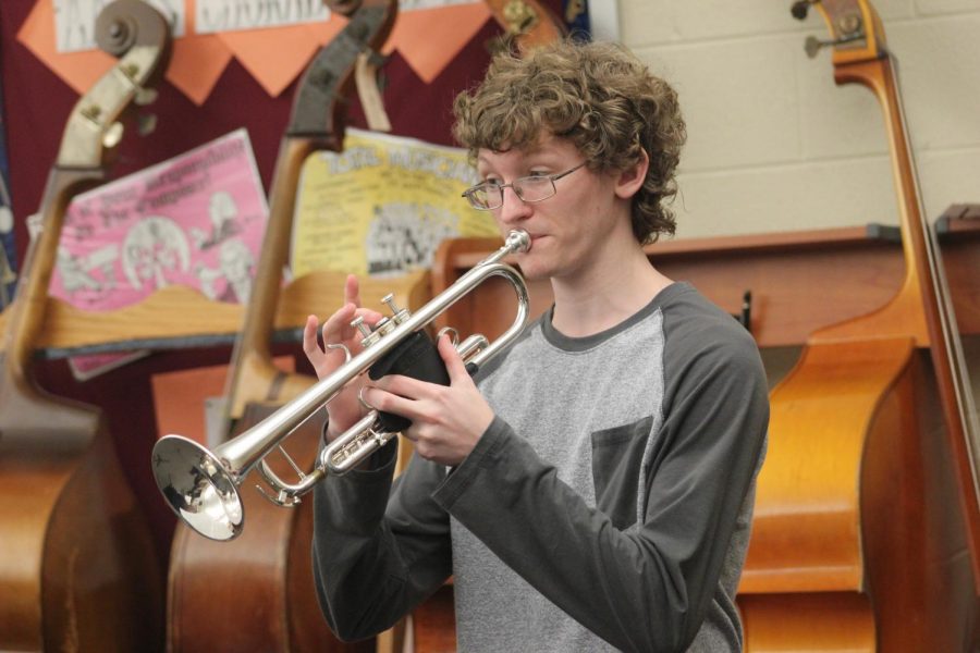 Senior Isaac Brumbaugh plays a mellow B natural and fits into the trumpet section. The jazz band is rehearsing for future performances. 