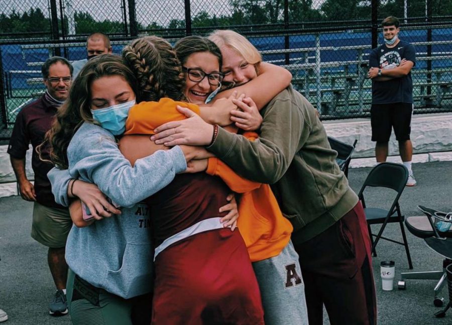 Score!
Sophomore tennis player Morgan Stevenss friends, Isabella Frank, Eve Hogan and Alaina Keolhle congratulate her on her big win. I loved having them there. They are pretty much my second family at this point, Stevens said. 