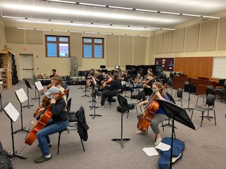 Getting Ready! The orchestra participates in their second practice at the junior high. The orchestra got ready for their second in-person class meeting, were six  feet apart and everyone wore masks.