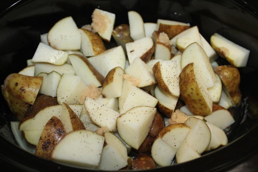 Once the potatoes, chicken broth and seasonings are in the crock pot, let them sit for six hours on a medium heat. The potatoes should be soft enough to mash when the six hours are over. 
