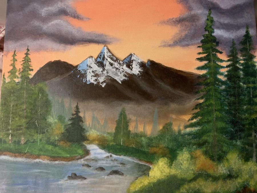 Painting. 
Senior Lily porter paints her acrylic realism photo. This is where an artist paints realistic objects with acrylic paint. This painting is a replica of a Bob Ross painting, and I won an award for it, Porter said.