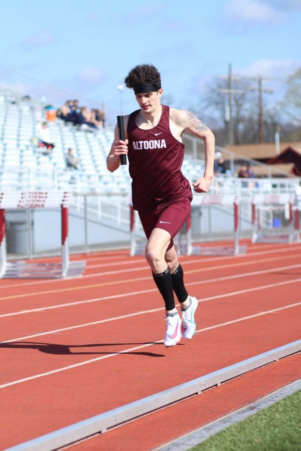 George Boutiller runs during the track meet on April 13 against Harrisburg. The team won that meet 109-23. 