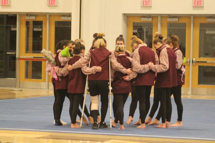 During the girls gymnastics senior night, they gather around in a circle. Gymnastics can be really fun even if you dont have a background in anything. We will teach you and you can be good at doing this if you put your heart in it, senior Cassandra Kyle said.