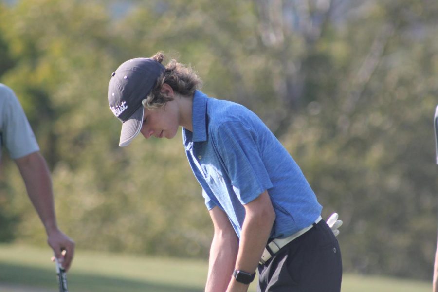 Swing! Sophomore, Daniel Batrus gets ready to swing his club. The golf team plays on many local courses including Park Hills.
