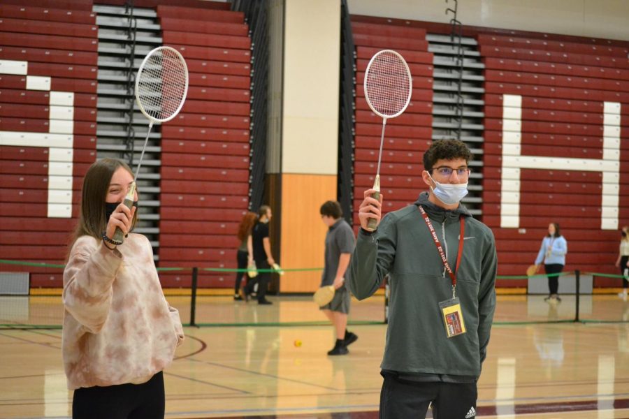 Both rackets in the air Senior George Boutiller and junior Jocelyn Stout play badmitten in second period. I think that the no-suits are necessary to have kids willing to participate in gym, Boutiller said.