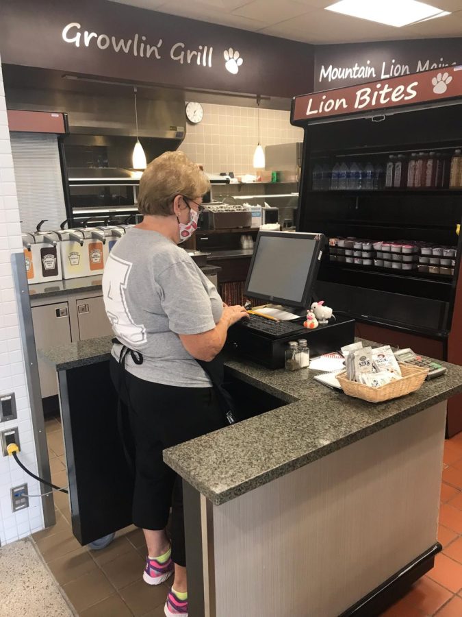 Lunch time Cafeteria worker Joanne Defrancesco types on her monitor during lunch. She rung up students as they passed through. 