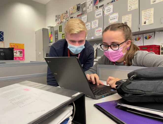Working on it Junior Eli Peteuil and Editor in Chief, senior Destiny Montgomery go over a story in time to publish for the story rotation due date. 