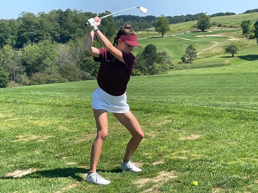 Swing+that+club+Jenna+Williams+swings+her+club+at+the+ball+golf+ball.+Williams+expressed+that+she+is+glad+there+is+a+golf+team+this+year+for+her+and+her+teammates+to+grow+on.+