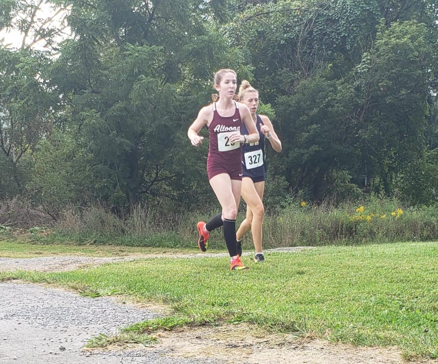 Catching up Senior Mackenzie Kelley pulls ahead of her competitor. Kelley qualified for the State Competition for her fourth year in a row. 