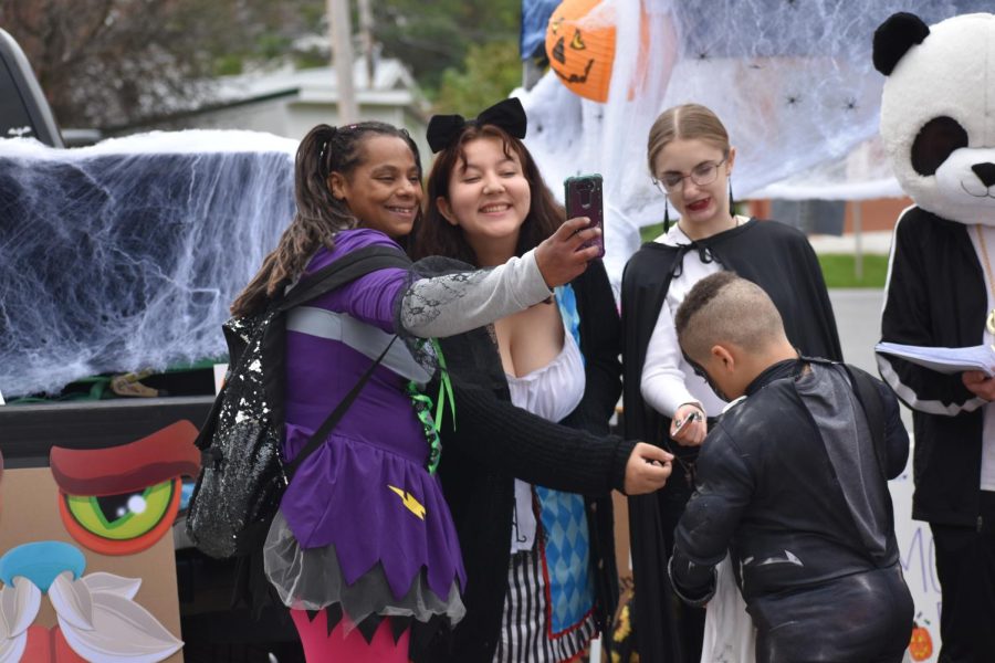Selfie time Junior Mykenzi Doran poses for a picture with Talicia Laurence. Many people asked to pose with some people handing out candy. 