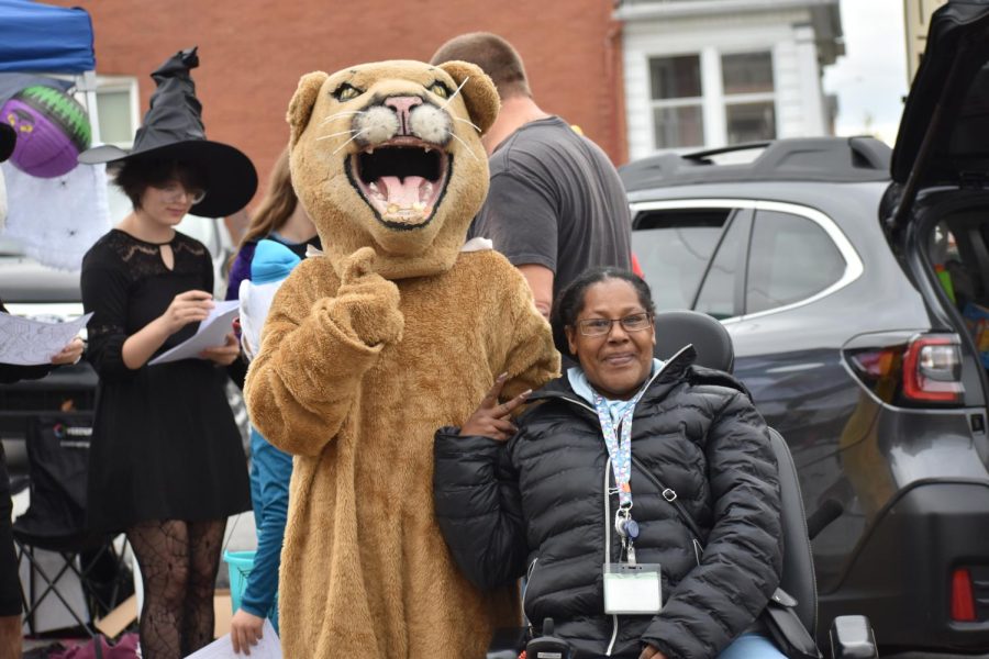 Is that the mountain lion The mountain lion mascot poses with someone at trunk or treat. The publication staffs borrowed the mountain lion costume to use during trunk or treat. 