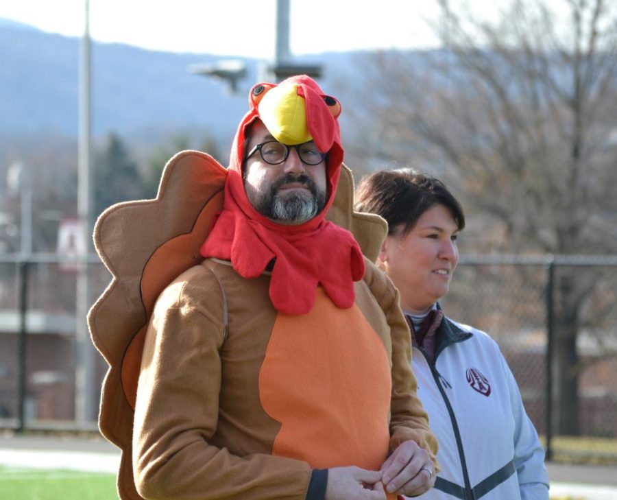 Lets go AAHS Head principal Andrew Neeley and assistant principal Keri Harrington unite to watch the championship game of the Turkey Bowl event. Neeley dressed as a turkey in honor of the events name. 