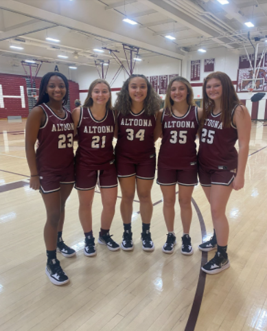 Brooklyn Baron, Taylor Lane, Nevaeh Gibson, Avery Burchfield, and Abbie Herncane smile for a picture before practice starts.  They are excited about what the rest of the season will look like for them.  