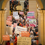 About 1000 people filled the Minnesota capitol rotunda to demand stricter gun control laws. They protested against stand your ground and permit-less carry laws and demanded stricter laws on guns such as a ban on assault rifles. After the Rally, they visited the Governor’s office to urge him to veto dangerous gun bills.