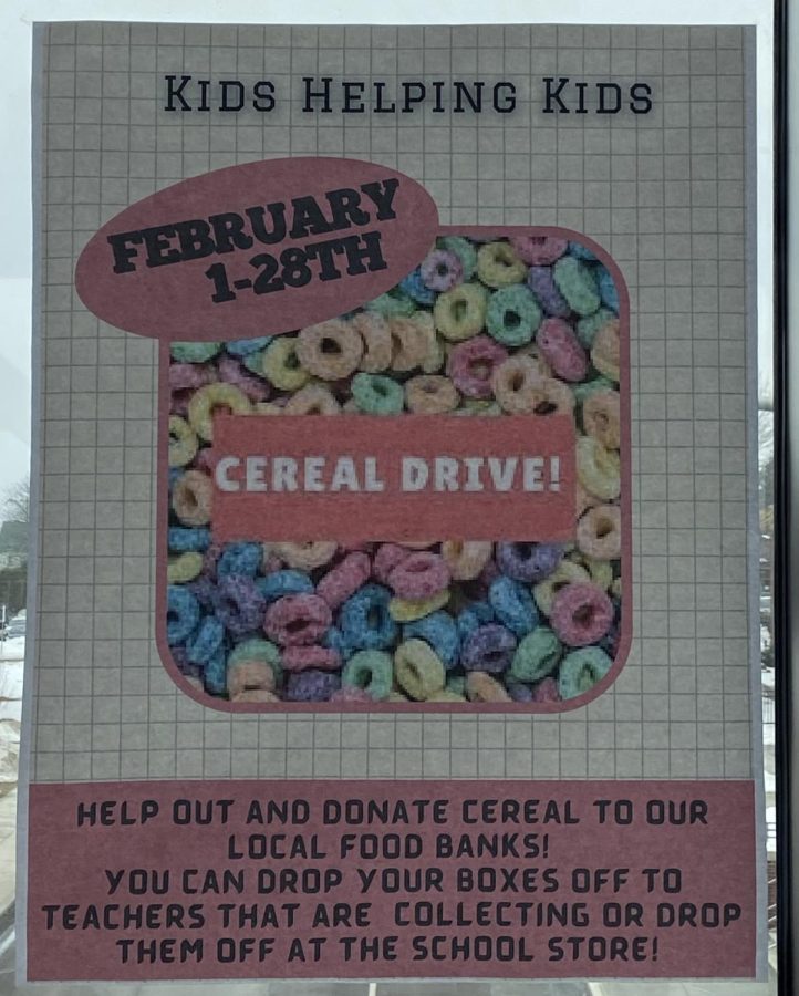 Student council hangs cereal drive posters around the school. The posters encourage students to participate in the annual cereal drive. 
