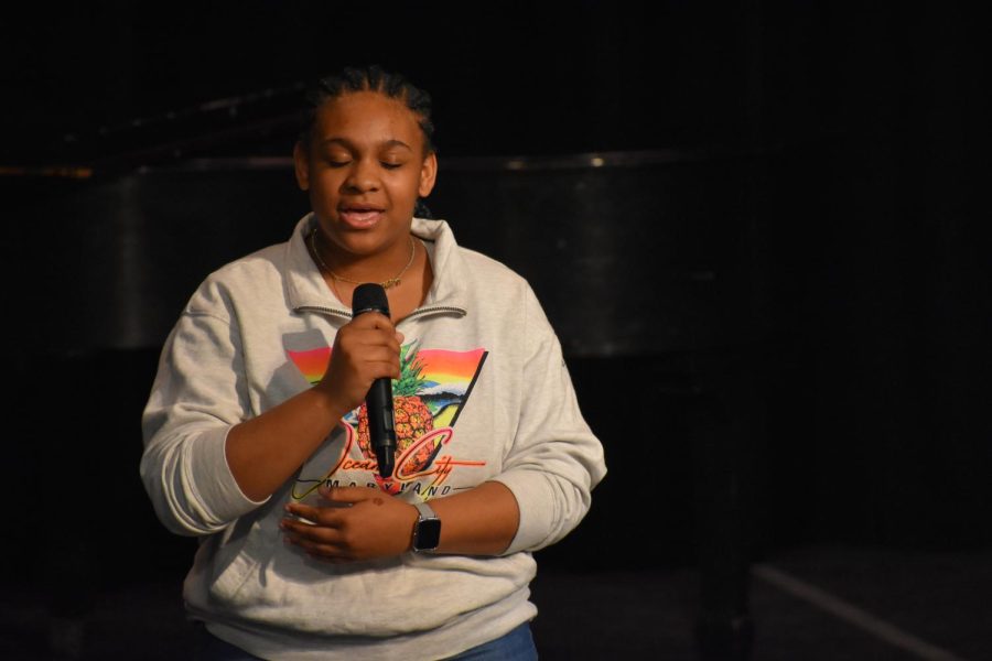 Facing fears. Sophomore Nahjay Harding closes her eyes to focus on her singing. Harding sang Easy on me. She wanted to face her fear of singing in front of people.