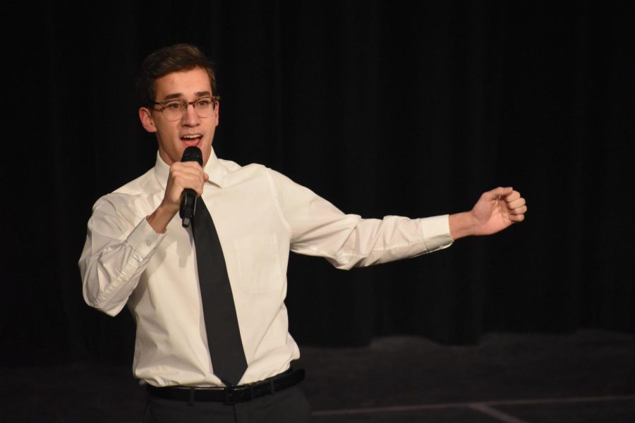 Vocalizing. Sophomore Benjamin Kennedy sticks his arm out expressing his emotions whiling singing. Kennedy sang Out there. Kennedy is member of the drama club and will be performing in the upcoming production of Newsies.