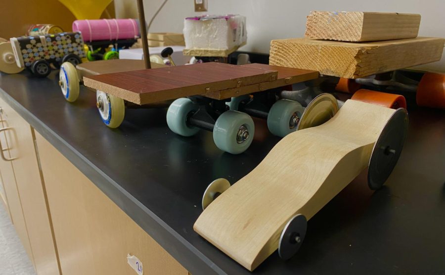 Lets Roll
Students in Jeremy Rupekas physics class display their final presentations for their gravity car assignment. Many students cars performed well and traveled a far distance from the ramp. 
