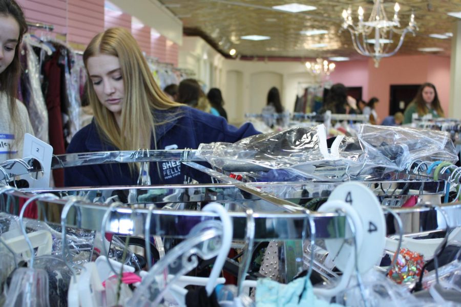 Just one Volunteer Frankie Price looks through the dresses. United Way of Blair County partnered with the Logan Valley Mall for the Glass Slipper project.
