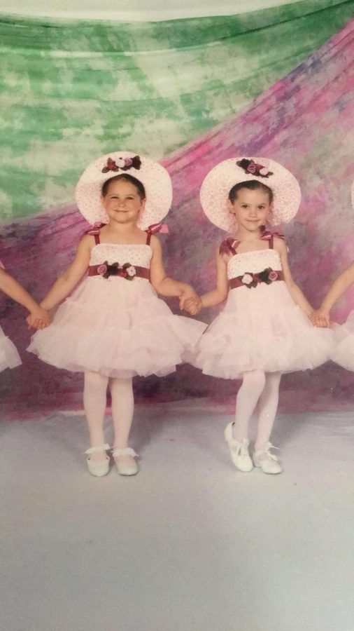 First dance. 
Senior Emma Dietrick and junior Emma Peterman pose for a photo in their dance costumes as little kids. They met when they learned their first dance together. 