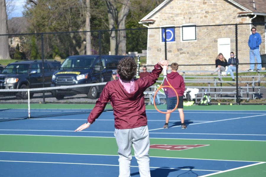 Junior Mason Crownover returns a serve. Altoona boys tennis singles Districts ended yesterday.
