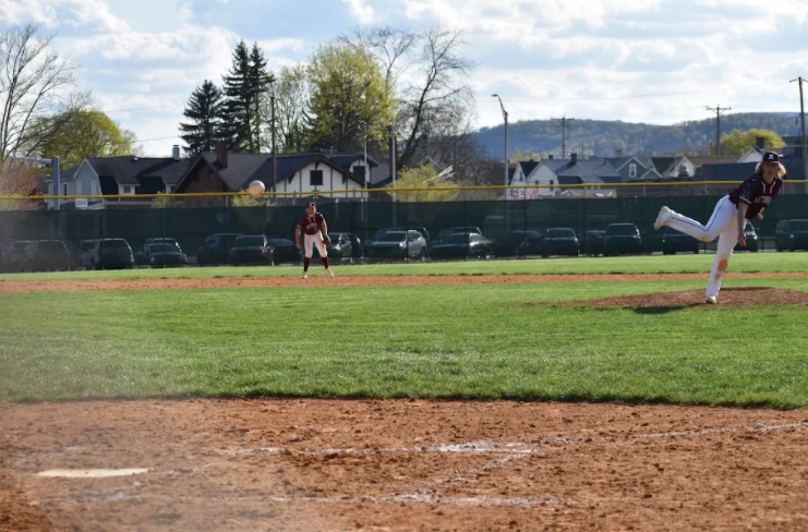 Grabbing for baseball season. Senior Aiden Steinbugl waits for the ball to hit back at him as it is being pitched. 