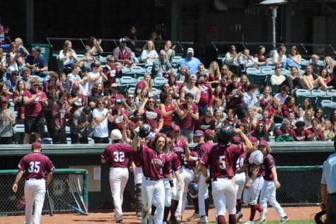 Hooray! Altoona baseball players and the crowd cheering. Everyone was cheating because Altoona scored three points in a row. 