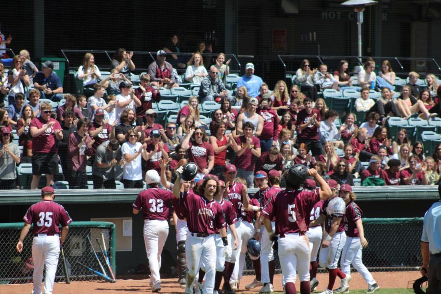 Hooray! Altoona baseball players and the crowd cheering. Everyone was cheating because Altoona scored three points in a row. 