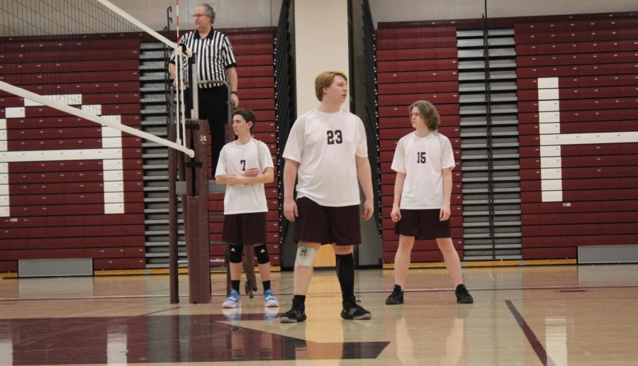 Lining up. Junior Dustin Baughman (right) lines up with teammates Joseph Ball (center) and Justin Fleck (left), ready to play the Central High School Boys Volleyball team. The entire Junior Varsity team was ready to start defending their soon to be undefeated record. 
