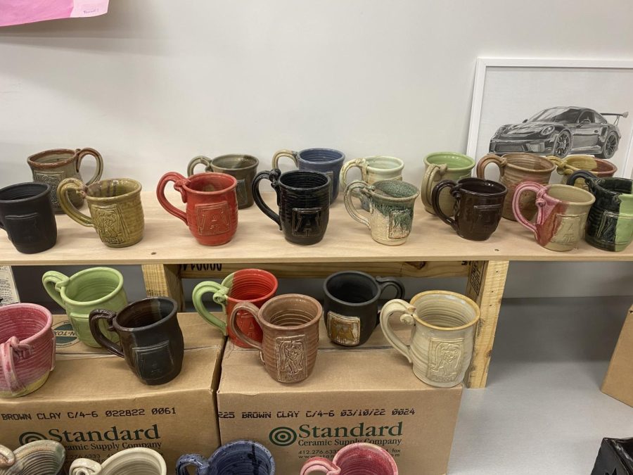 The mugs are in all different colors. They can still be purchased in room 229. 
