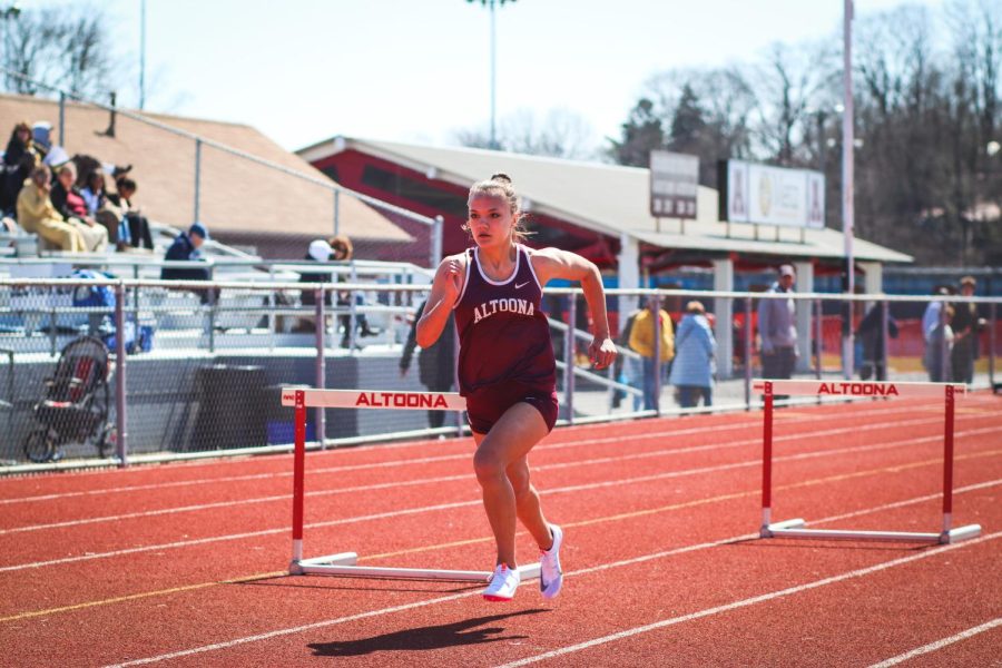 Sights set for the finish line Sophmore Hailey Kravetz competes in the 100 meter hurdles. She remained focused to prepare herself for the next hurdle. 