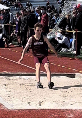 Jump. CJ Romanowicz lands a triple jump at the Igloo invitational on April 2, 2022. Romanowicz aimed for his personal record of 34’10” at this meet. 