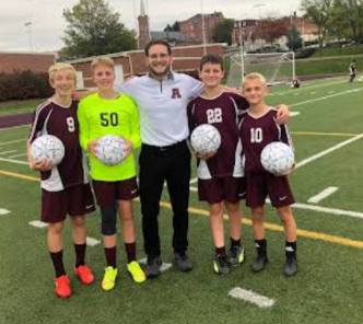 This is a picture with my 8th graders and I. I may have more coaching pictures; it just may take until I get back from Disney to get them to you.
Students are from left to right: Braxton Eckenrode, Ethan Hicks, Zach McGary, Jace Black, Marasco said. 