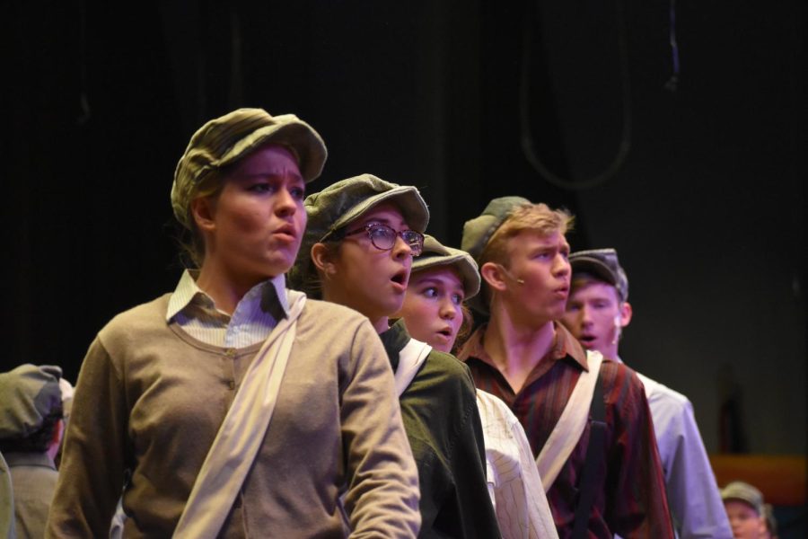 Taking a stance. Newsies face the audience while they take a stand to change the way they are being paid. It was a really nice opportunity to get to work with the cast and perform such an amazing musical. I really enjoyed it and cant wait to perform more with the drama club, sophomore Jaidyn Palladini said.